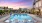 pool area with reclining seats and landscaping