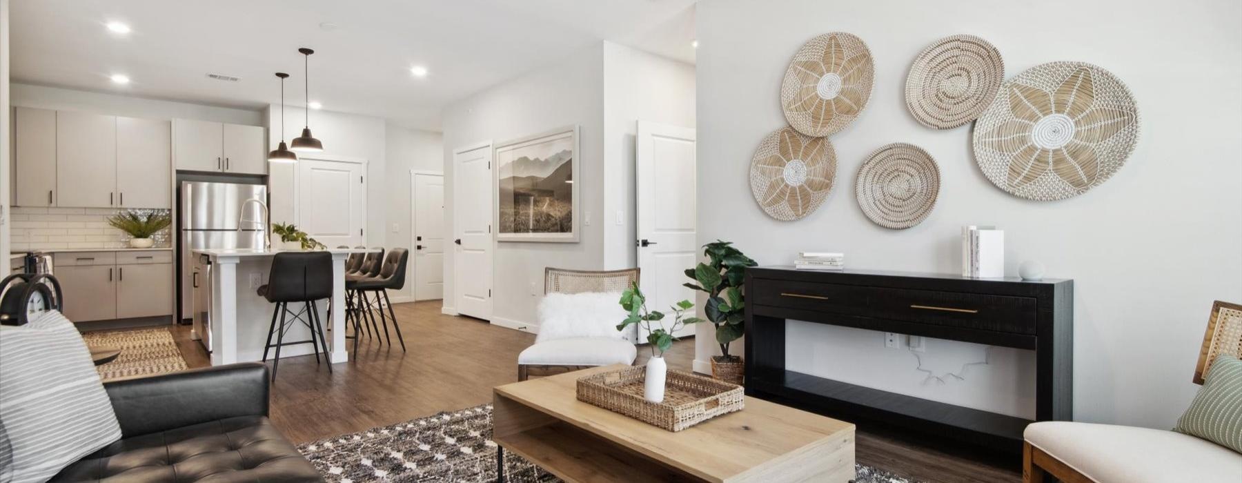 a living room with a fireplace and a table with plates on it