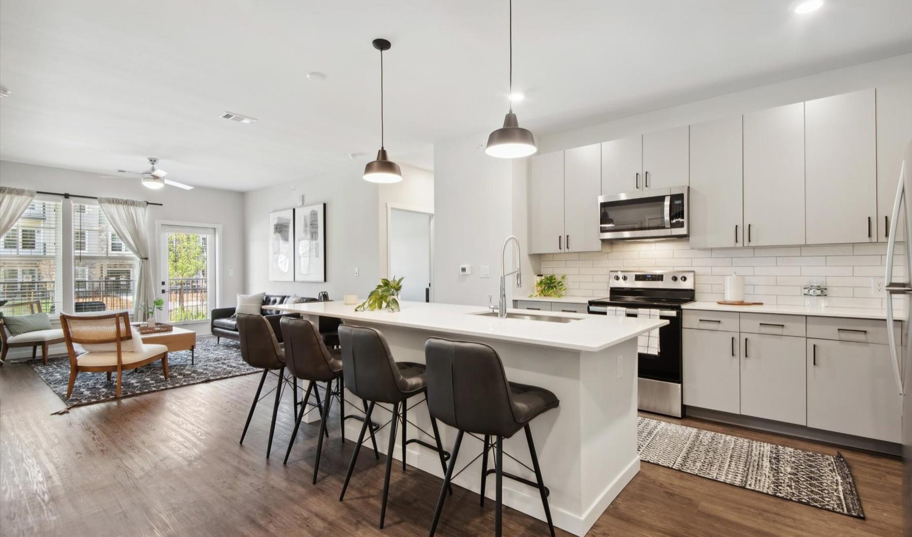 a kitchen with white cabinets