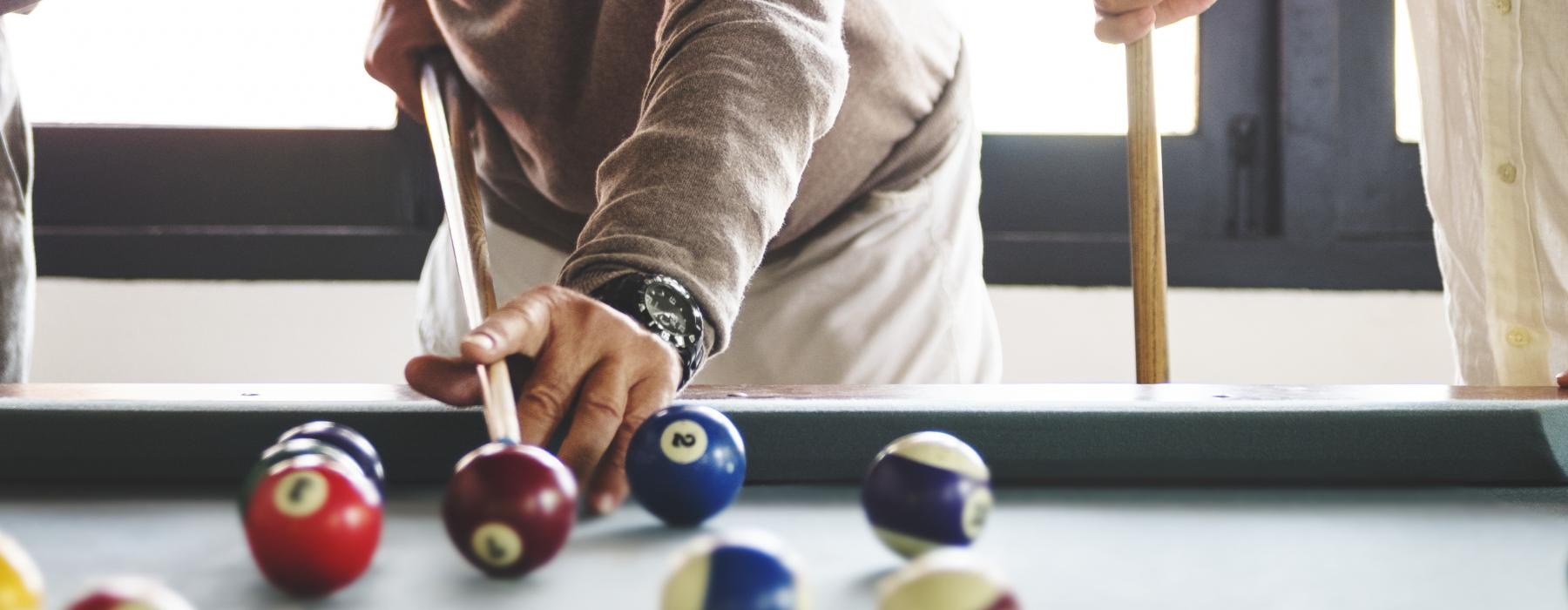 a person playing pool