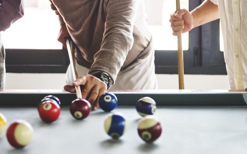 a person playing pool